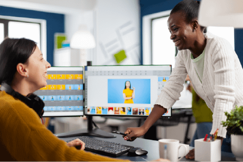 A two woman team designing a website